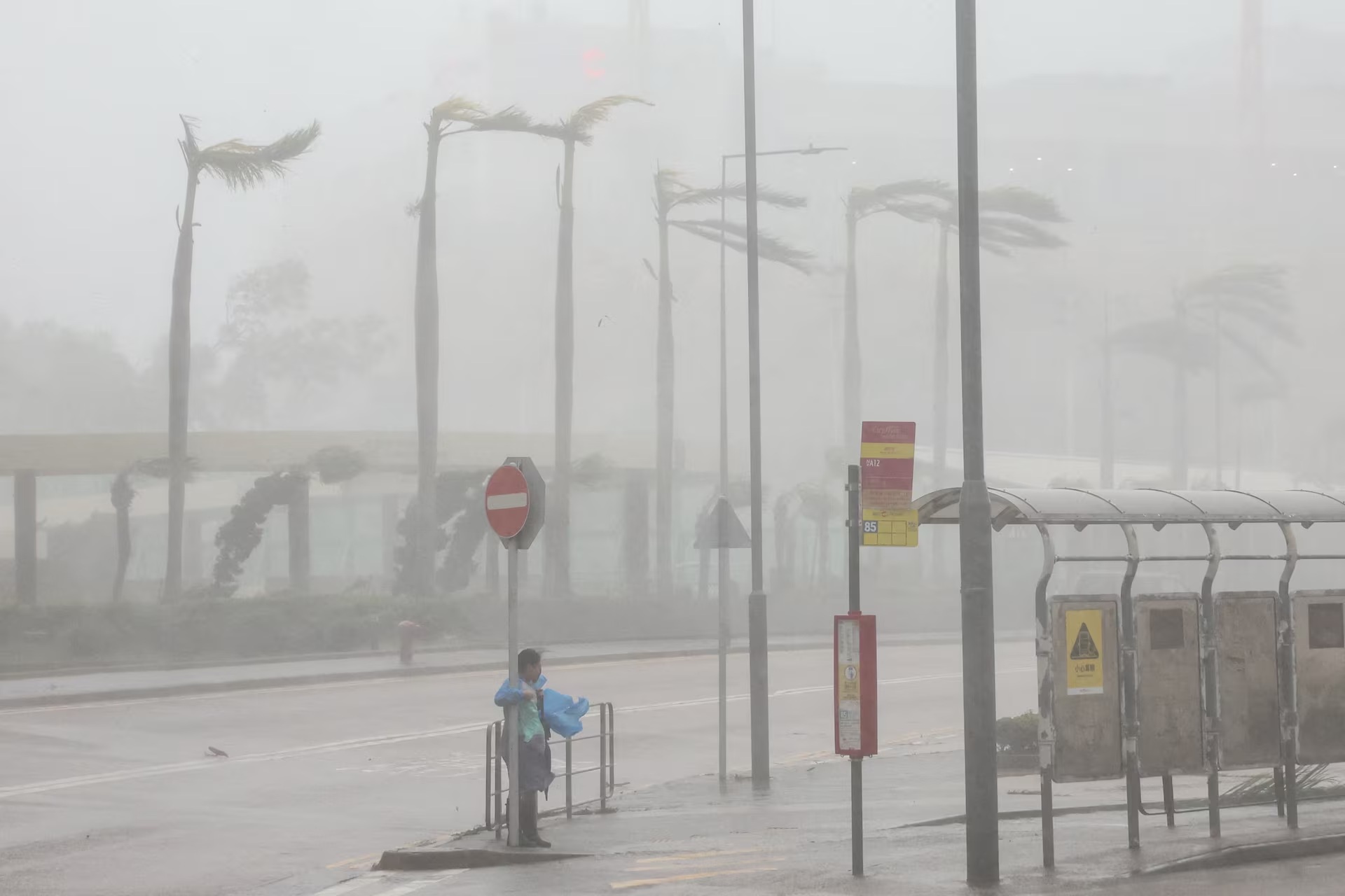 Waves from Super Typhoon Ragasa crash onto chairs by the shore in Hong Kong.jpg